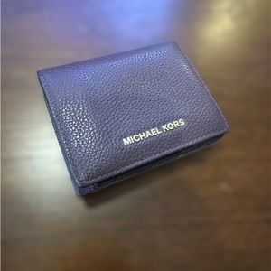 Michael Kors Mercer card case, pebbled leather with silver-tone metal hardware.